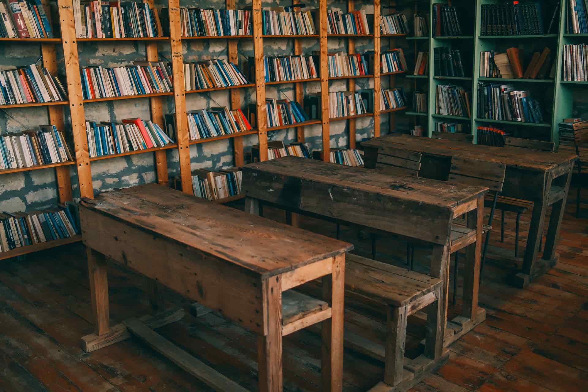 Woodworking books and plans open on a wooden desk